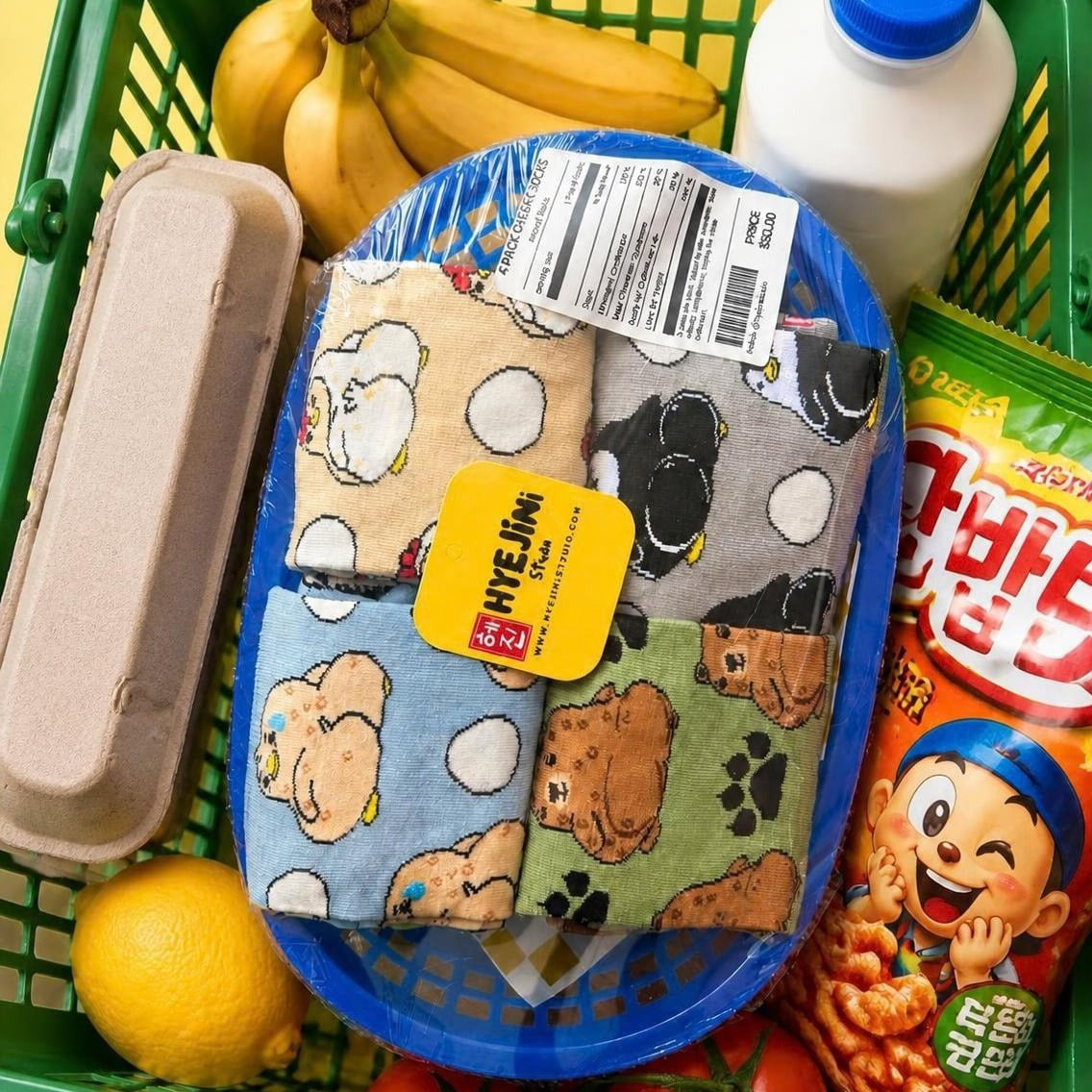 Cheeky Collection socks multipack: four pairs of character socks packaged in a grocery basket