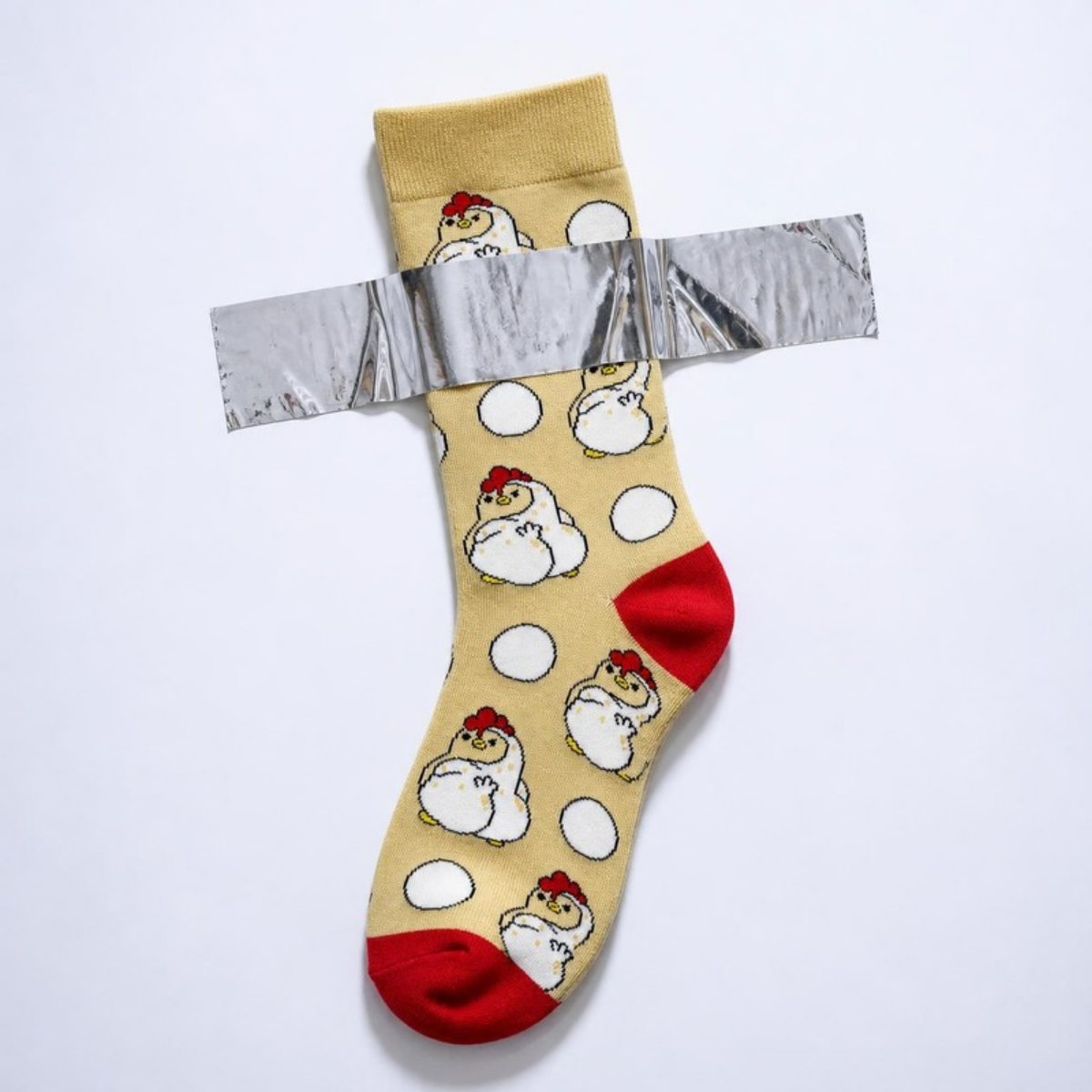 Sassy Chicken Sock taped to a white wall